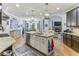 Modern eat-in kitchen with granite island and stainless steel appliances at 1185 Weldstone Ct, Atlanta, GA 30350