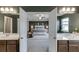 Double vanity bathroom with view to main bedroom at 3159 Lantana Way, Buford, GA 30519