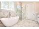 Bathroom with soaking tub, glass enclosed shower and a view at 43 Iroquois Ct, Covington, GA 30014