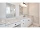 Bright bathroom featuring double vanities, and lighted mirrors at 43 Iroquois Ct, Covington, GA 30014
