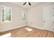 Bedroom featuring natural light from windows and hardwood floors at 43 Iroquois Ct, Covington, GA 30014