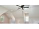 Spacious bedroom boasts neutral tones, natural lighting, and a ceiling fan at 43 Iroquois Ct, Covington, GA 30014