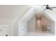 A bonus room with vaulted ceilings, fresh paint, carpeted floors, and a ceiling fan at 43 Iroquois Ct, Covington, GA 30014