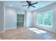 Bonus room with wood floors, a view to outside, and a view to the hallway at 43 Iroquois Ct, Covington, GA 30014