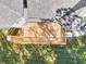 Aerial view of a large wooden deck surrounded by a green lawn and trees at 43 Iroquois Ct, Covington, GA 30014