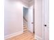 Welcoming foyer with wood floors, door with stairs visible, and crisp white trim at 43 Iroquois Ct, Covington, GA 30014