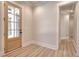 Bright entryway featuring a wood door, wood floors, and neutral paint at 43 Iroquois Ct, Covington, GA 30014