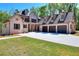 Spacious brick home with a three-car garage, wide driveway, and well-maintained lawn at 43 Iroquois Ct, Covington, GA 30014