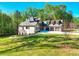 Beautiful two-story brick home featuring a three-car garage, well-manicured lawn and a long driveway at 43 Iroquois Ct, Covington, GA 30014