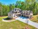 Beautiful two-story brick home featuring a three-car garage, well-manicured lawn and a long driveway at 43 Iroquois Ct, Covington, GA 30014
