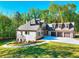 Beautiful two-story brick home featuring a three-car garage, well-manicured lawn and a long driveway at 43 Iroquois Ct, Covington, GA 30014