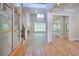 Grand foyer with hardwood floors, staircase, and views of the living room, creating a welcoming entrance at 43 Iroquois Ct, Covington, GA 30014