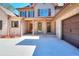 Inviting front entrance with decorative columns, wooden doors, and a spacious driveway at 43 Iroquois Ct, Covington, GA 30014