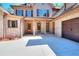 Charming front entrance featuring decorative columns, a wooden front door, and a spacious driveway at 43 Iroquois Ct, Covington, GA 30014