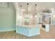 Bright kitchen featuring white cabinets, quartz countertops, stainless appliances, and wood flooring at 43 Iroquois Ct, Covington, GA 30014