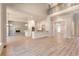 Large open-concept living space featuring kitchen, dining area, and living room with hardwood floors at 43 Iroquois Ct, Covington, GA 30014