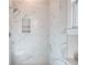 Luxurious shower with marble tile and a built-in niche at 43 Iroquois Ct, Covington, GA 30014
