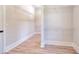 Bright walk-in closet featuring wire shelving and wood-look flooring at 43 Iroquois Ct, Covington, GA 30014