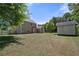 Large backyard with a shed and mature trees at 2401 Centennial Hill Nw Way, Acworth, GA 30102