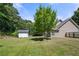 Large backyard with a shed and mature trees at 2401 Centennial Hill Nw Way, Acworth, GA 30102