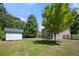 Large backyard with a shed and mature trees at 2401 Centennial Hill Nw Way, Acworth, GA 30102