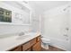 Clean bathroom featuring a tub shower combo and wood-look flooring at 2401 Centennial Hill Nw Way, Acworth, GA 30102