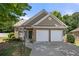 Brick ranch home with two-car garage and landscaped yard at 2401 Centennial Hill Nw Way, Acworth, GA 30102