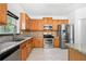 Kitchen with granite countertops and wood cabinets at 2401 Centennial Hill Nw Way, Acworth, GA 30102