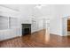 Bright living room with hardwood floors, fireplace, and built-in shelving at 2401 Centennial Hill Nw Way, Acworth, GA 30102