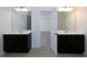 Double vanity bathroom with dark brown cabinets and access to bedrooms at 325 Allgood Trce, Acworth, GA 30101