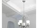 Elegant five-light chandelier with frosted glass shades at 325 Allgood Trce, Acworth, GA 30101