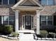 Inviting front entrance with brick facade and black front door at 325 Allgood Trce, Acworth, GA 30101