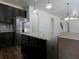 Modern kitchen with dark cabinetry and granite island at 325 Allgood Trce, Acworth, GA 30101