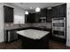 Modern kitchen with dark cabinetry and granite island at 325 Allgood Trce, Acworth, GA 30101