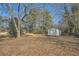 Large backyard with storage shed and mature trees at 5603 Owens Dr, Austell, GA 30106