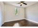 Spacious bedroom featuring hardwood floors and a ceiling fan at 5603 Owens Dr, Austell, GA 30106