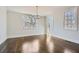 Elegant dining room with hardwood floors and a modern chandelier at 5603 Owens Dr, Austell, GA 30106