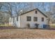 Side view of the house showcasing clean lines and landscaping at 5603 Owens Dr, Austell, GA 30106