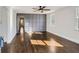 Spacious living room with hardwood floors and gray accent wall at 5603 Owens Dr, Austell, GA 30106