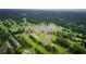 Aerial view of golf course with clubhouse and ponds at 89 1St Ne Ave, Atlanta, GA 30317