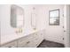 Modern bathroom boasts double vanity, gold fixtures, and hexagon tile floor at 89 1St Ne Ave, Atlanta, GA 30317