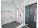 Elegant bathroom with marble shower and hexagonal floor tile at 89 1St Ne Ave, Atlanta, GA 30317