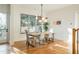 Bright dining area with hardwood floors and stylish light fixture at 89 1St Ne Ave, Atlanta, GA 30317