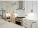 Stainless steel appliances and white shaker cabinets in this kitchen at 89 1St Ne Ave, Atlanta, GA 30317