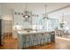 Modern kitchen with island, white cabinets, and hardwood floors at 89 1St Ne Ave, Atlanta, GA 30317