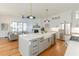 Modern kitchen with a large island, stainless steel appliances, and hardwood floors at 89 1St Ne Ave, Atlanta, GA 30317