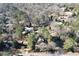 Aerial view showing home's location in a wooded neighborhood at 9935 La View Cir, Roswell, GA 30075