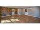 Finished basement with brick wall and hardwood floors at 9935 La View Cir, Roswell, GA 30075