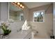 Updated bathroom with white tile and a quartz vanity at 9935 La View Cir, Roswell, GA 30075