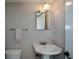 Small bathroom with pedestal sink and mirror at 9935 La View Cir, Roswell, GA 30075